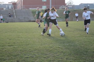 FRESHMAN ELLIE SAKSA defends against Granville Central April 15. Tori Nothnagel/The Omniscient