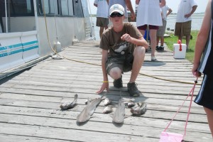 Christian Quinlan shows off his catch. Quinlan, a junior, says he fishes at least twice a week. Photo courtesy of Christian Quinlan