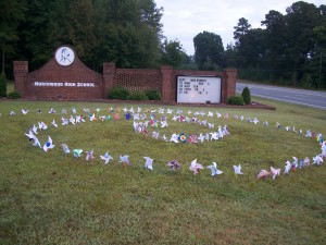 Art Club makes Pinwheels for Peace and Honors Arts students set them up in front of the school. 