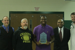 Imoh Udoh accepts Scholar Athlete of the Month award from 99.9 The Fan. Meredith Norman/ The Omniscient.