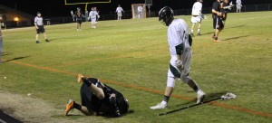 Junior Cole Walker stands over a fallen Orange player. Walker received a penalty for taunting. Skyler Waugh/The Omniscient