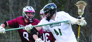 The lacrosse team recently changed their helmet colors from black to green. Jessica Kolomichuk/The Omniscient