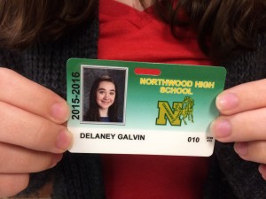 Sophomore Delaney Galvin holds her new student identification card. Becca Heilman/The Omniscient