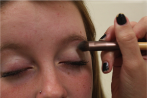 Apply a cream colored shadow to the inside corners of your lids and to your brow bone to highlight.