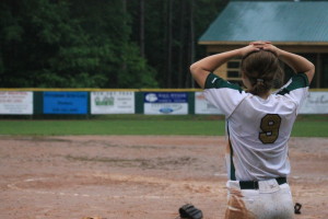 Junior Carson Shaner reflects after the softball team's third round playoff loss. Hannah Gail Shepherd/The Omniscient
