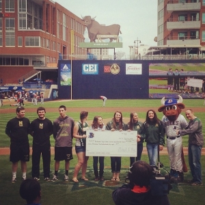 Congrats to the NW baseball and softball teams for raising over $2,000! They held the check at the Durham Bulls baseball game! #durhambulls